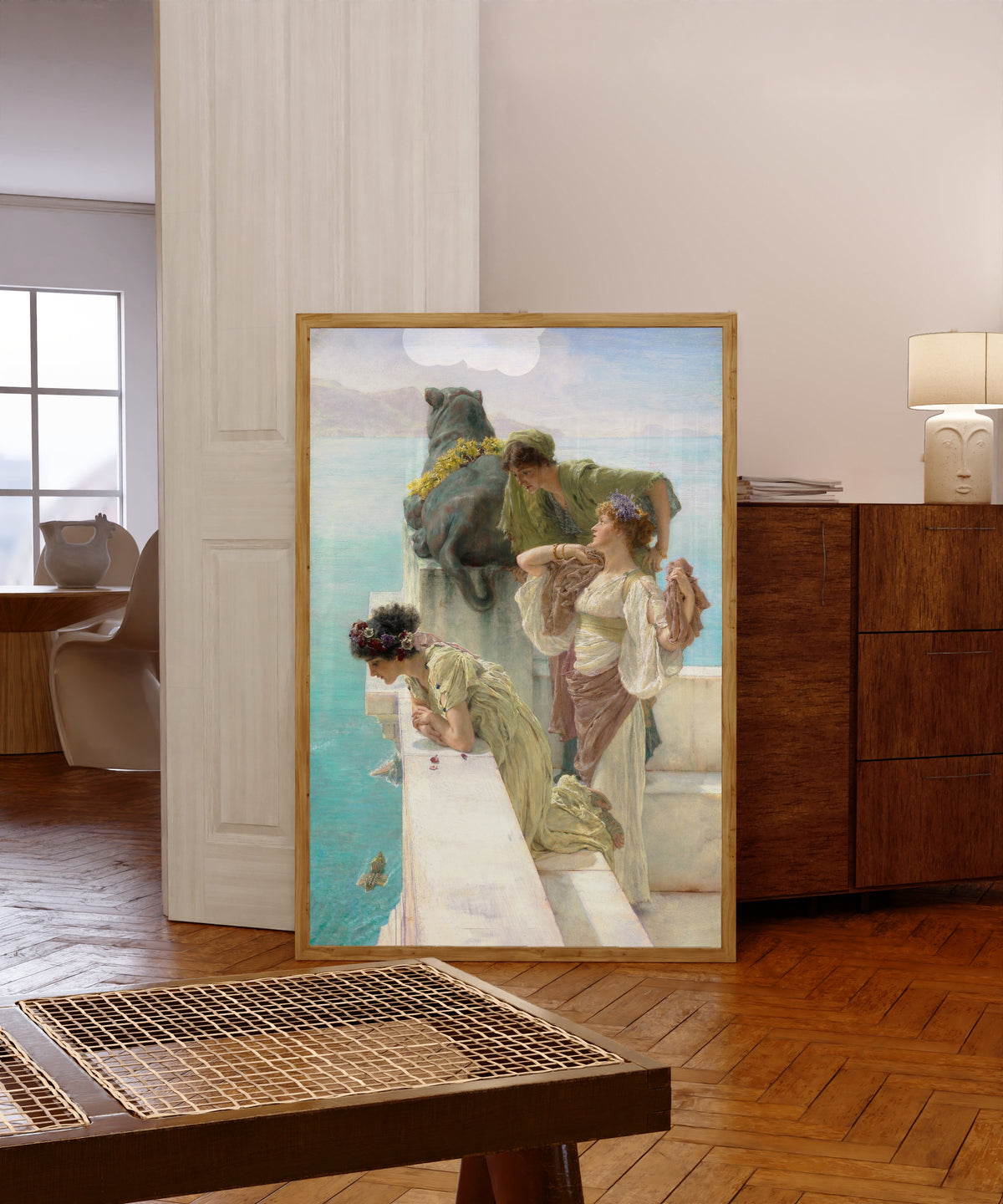 Framed art print of A Coign of Vantage by Lawrence Alma-Tadema, in a light wood frame leaning in a warm room with a parquet floor