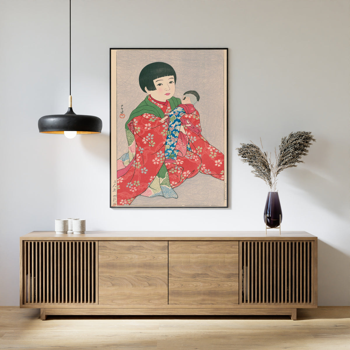 Framed art print of A Doll by Kawase Hasui, above a slatted wood sideboard