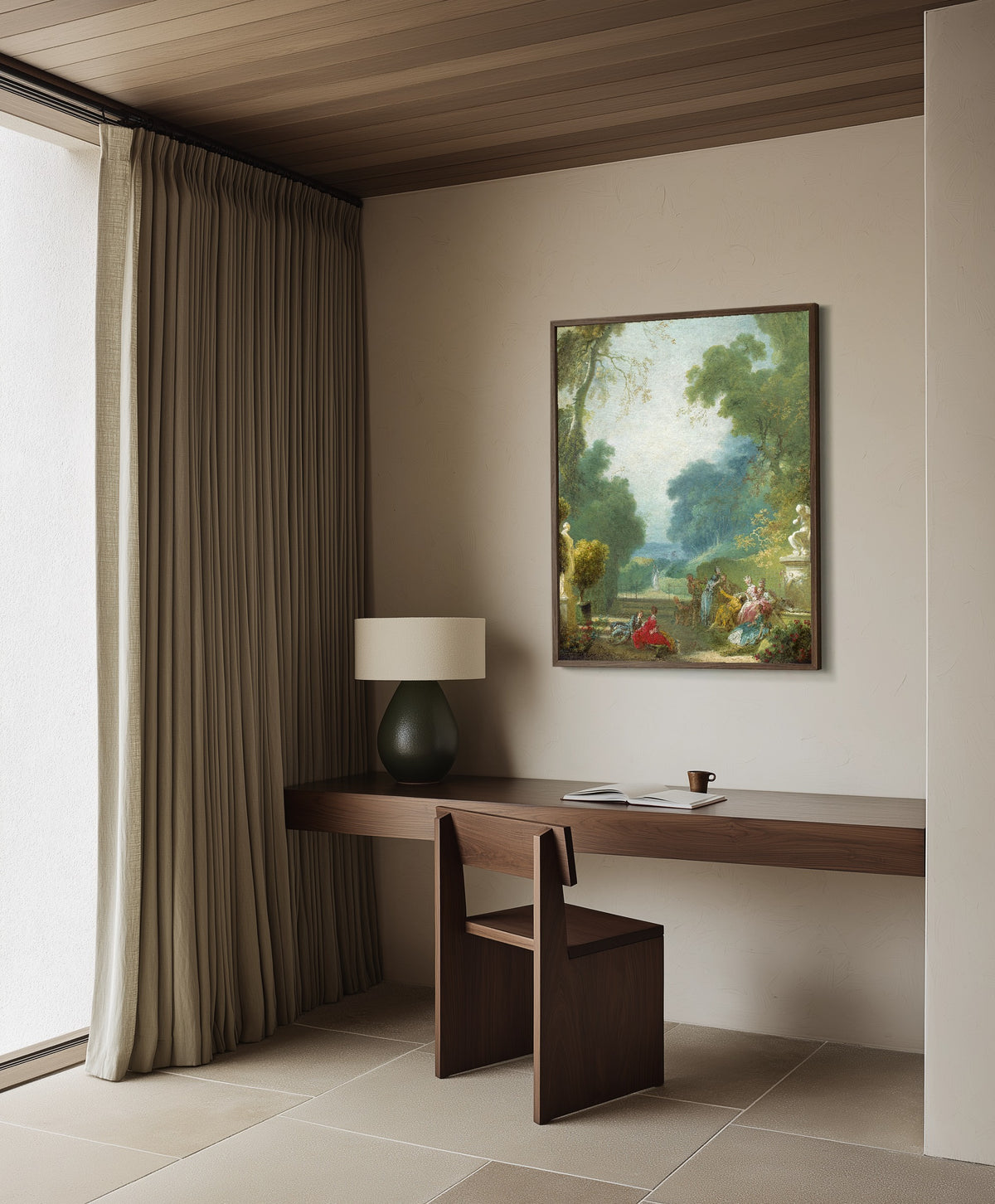 Framed art print of A Game of Hot Cockles by Jean-Honoré Fragonard, in a dark wood frame on a plaster wall above a walnut desk