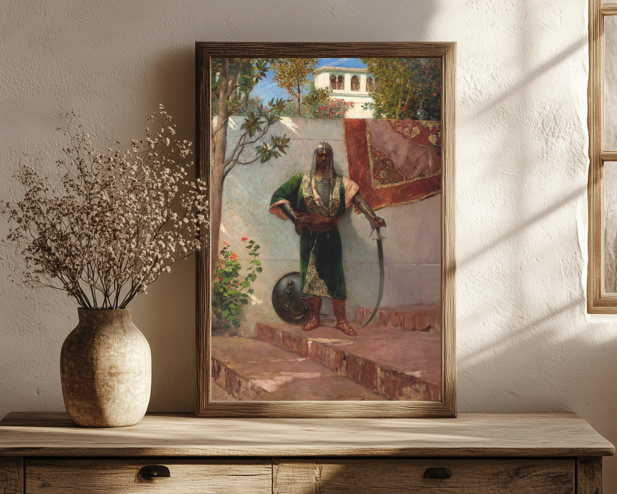 Framed art print of A Janissary by Jean-Joseph Benjamin-Constant, in a dark wood frame leaning on a rustic console beside dried flowers