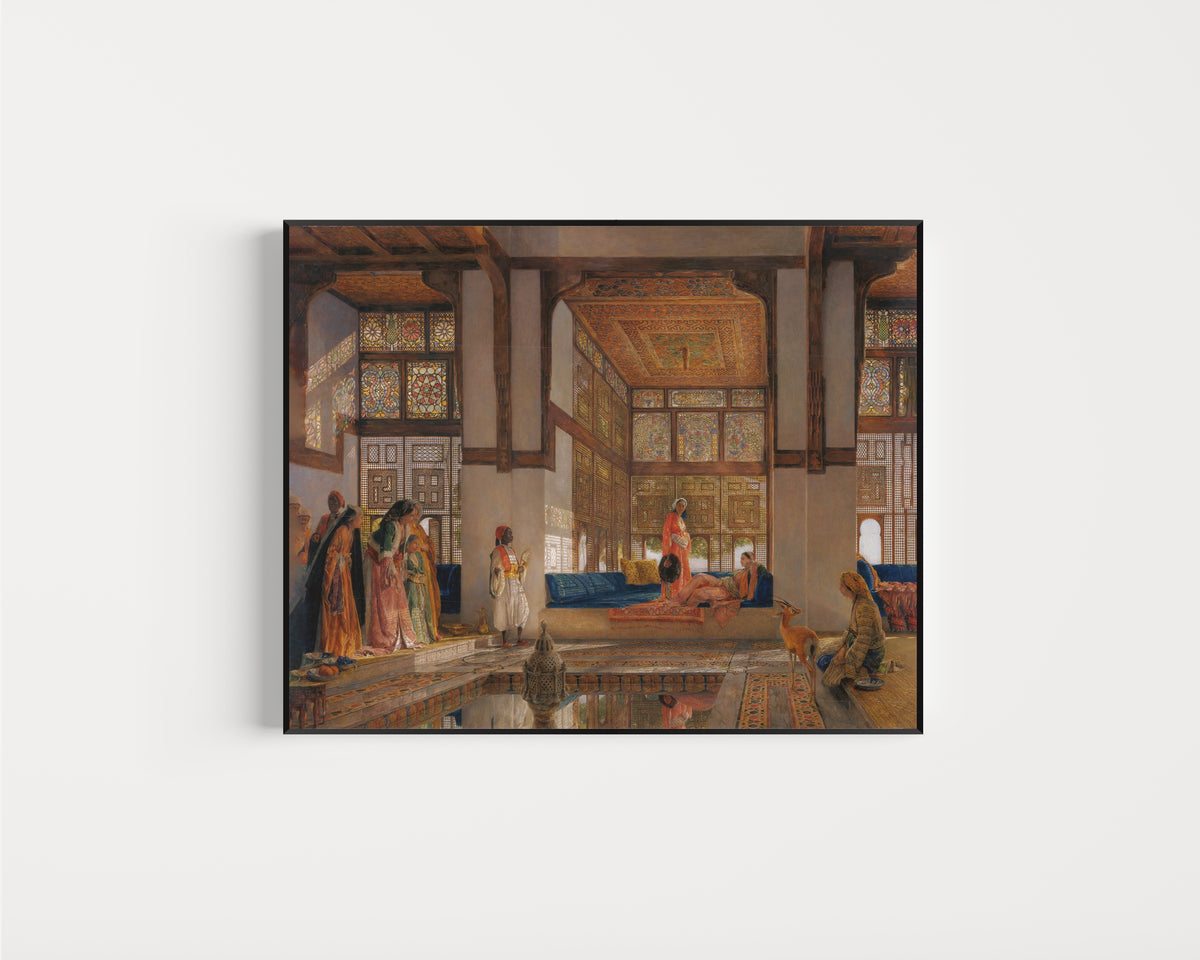Framed art print of A Lady Receiving Visitors (The Reception) by John Frederick Lewis, in a slim black frame on a plain white wall
