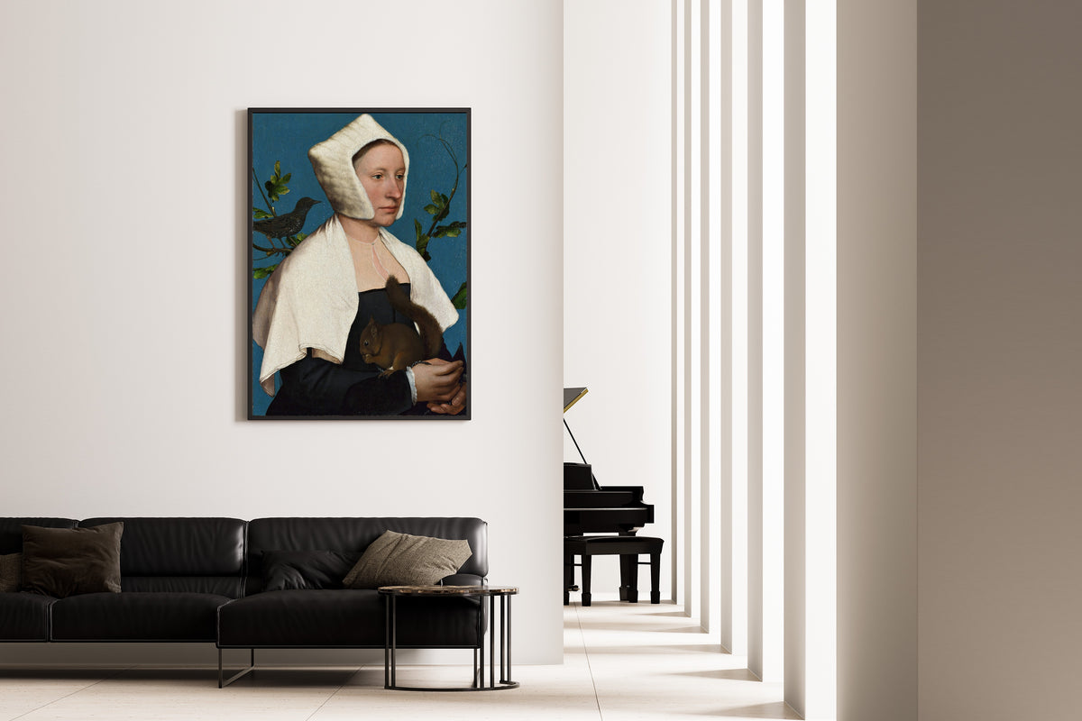 Framed art print of A Lady with a Squirrel and a Starling by Hans Holbein the Younger, on the wall of a minimal living room