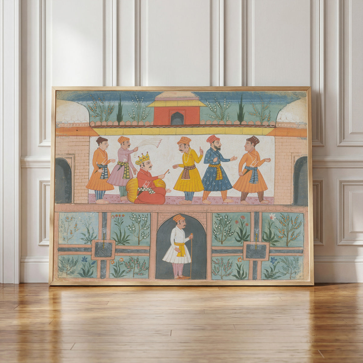 Framed art print of A Messenger Is Dispatched by Bilaspur school, in a light wood frame leaning against a panelled white wall