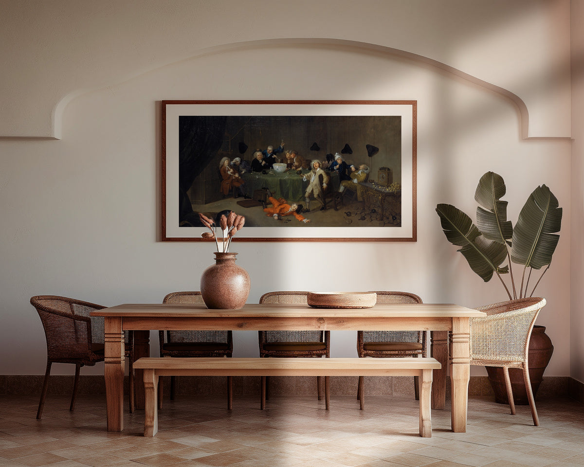 Framed art print of A Midnight Modern Conversation by William Hogarth, above a wooden dining table