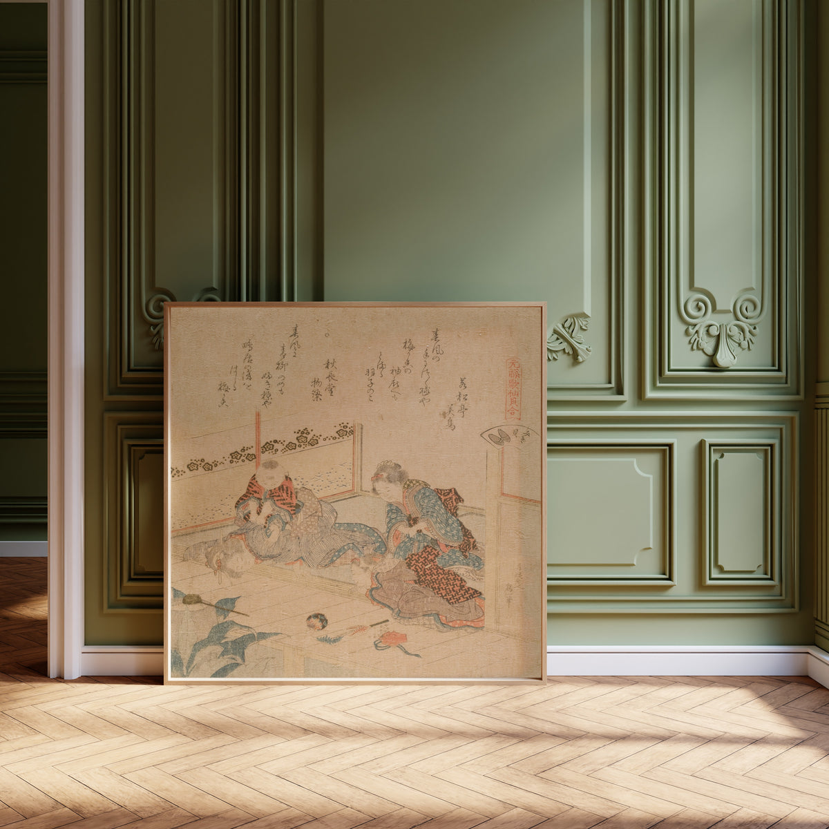 Framed art print of Abalone by Katsushika Hokusai, leaning against olive-green panelling on a herringbone floor