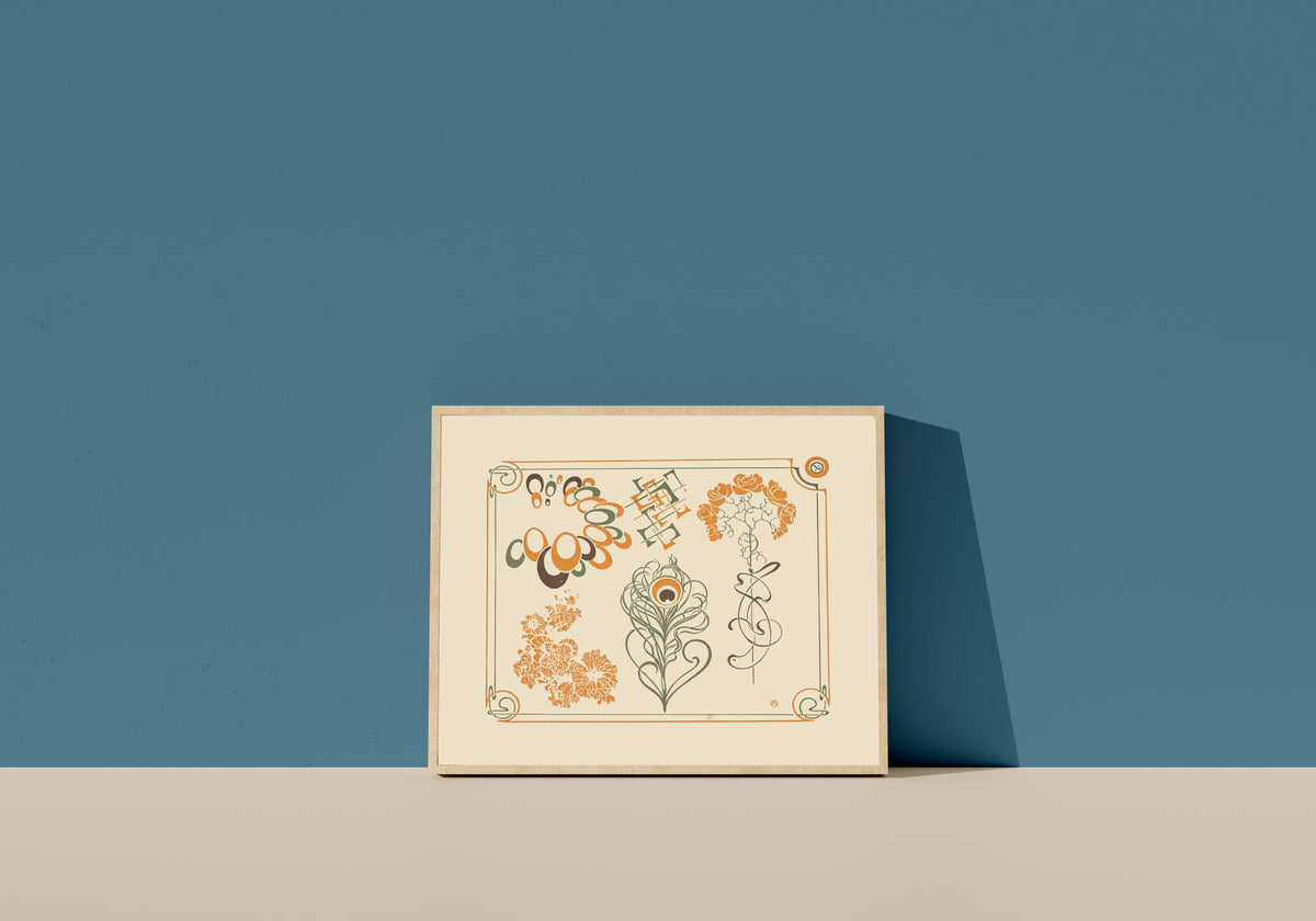 Framed art print of Abstract design based on flowers and curvilinear shapes by Alphonse Mucha, in a light wood frame leaning on a blue wall