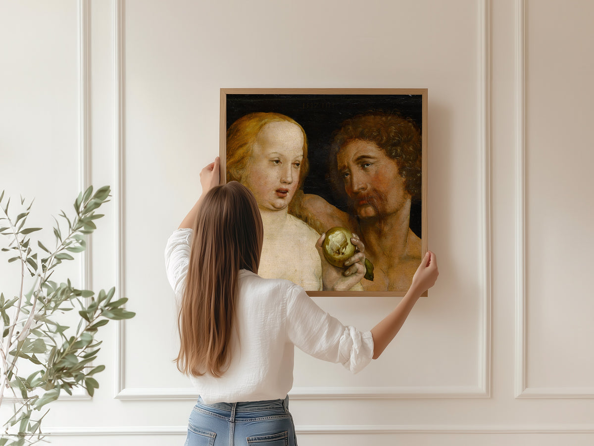 Framed art print of Adam and Eve by Hans Holbein the Younger, hung on a panelled wall