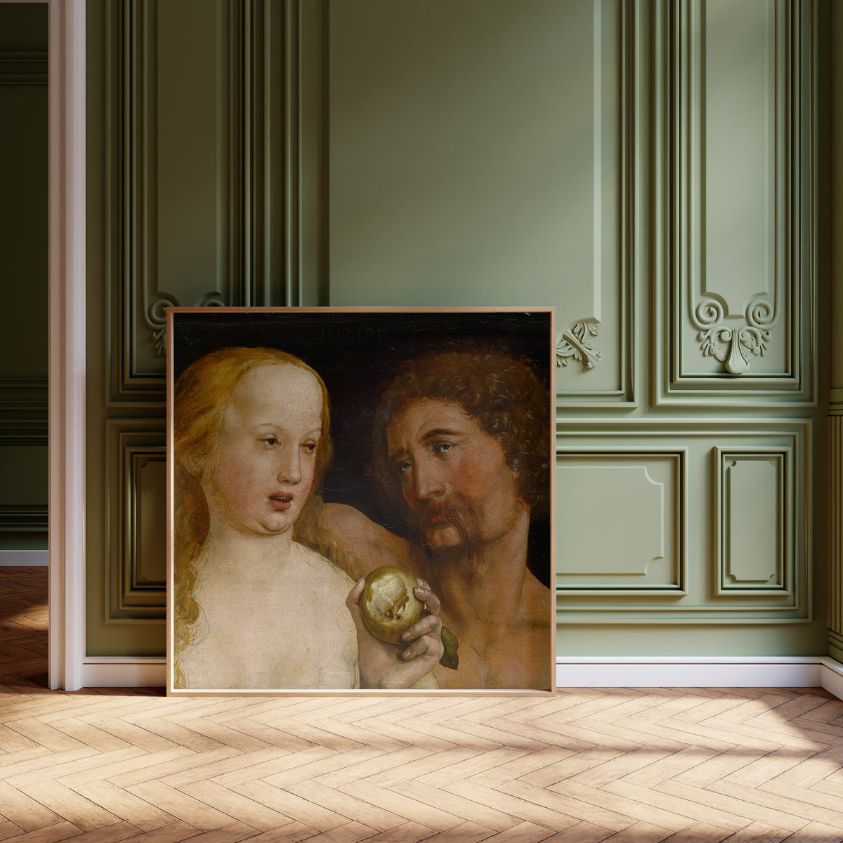 Framed art print of Adam and Eve by Hans Holbein the Younger, leaning against olive-green panelling on a herringbone floor