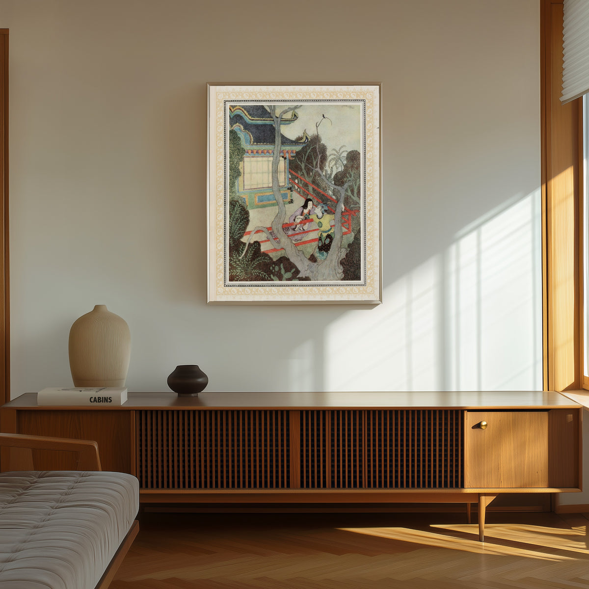 Framed art print of Aladdin finds the Princess in Africa by Edmund Dulac, in a thin light frame on a sunlit wall above a wooden sideboard