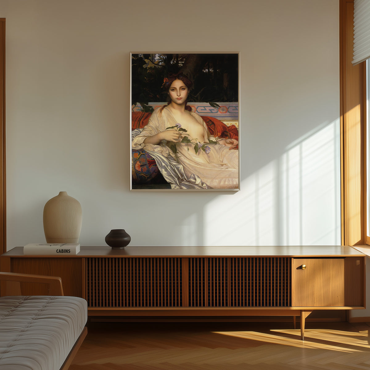 Framed art print of Albaydé by Alexandre Cabanel, in a thin light frame on a sunlit wall above a wooden sideboard