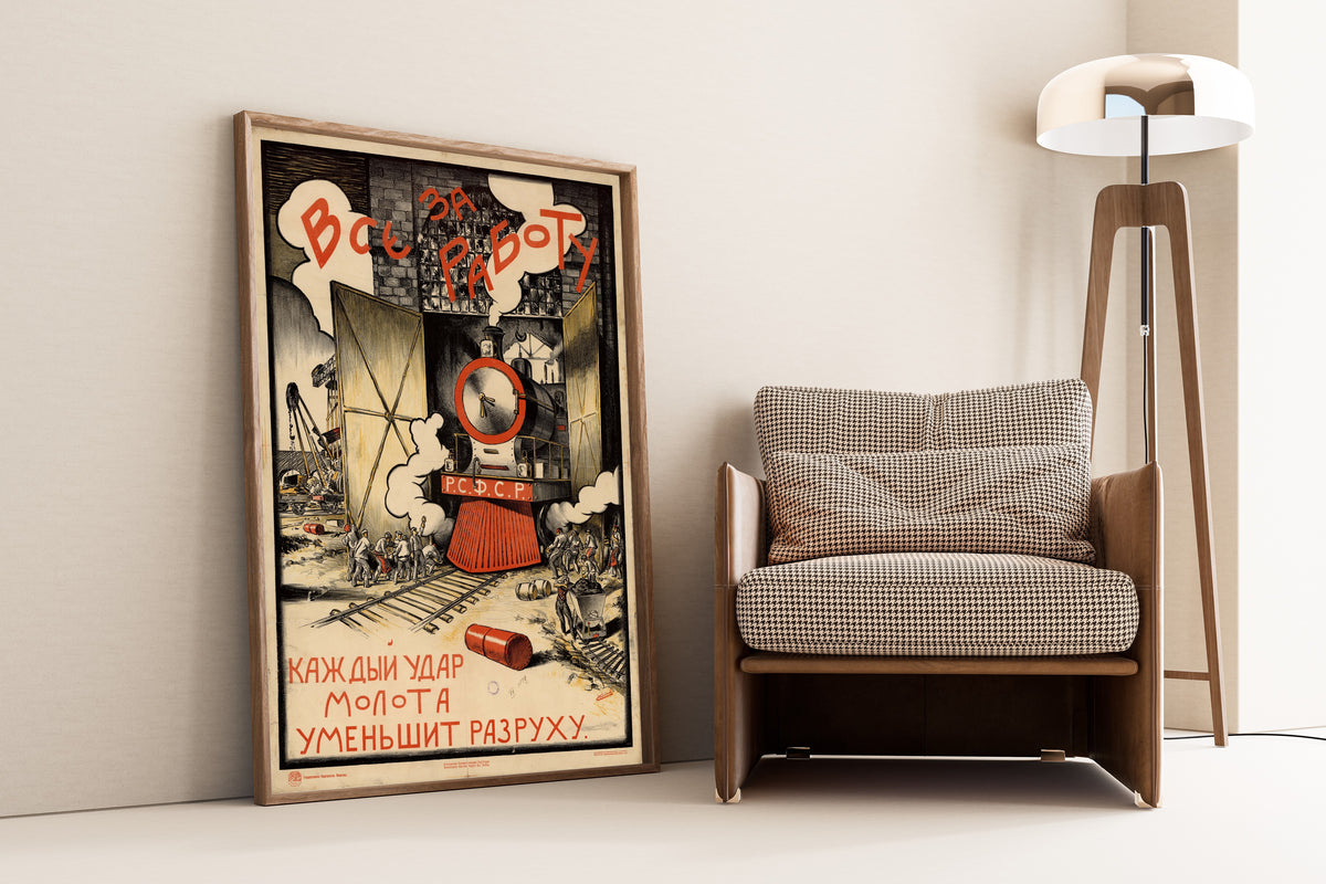 Framed art print of All to Work: Every Blow of the Hammer Lessens the Ruin by Sergey Ivanov, leaning against a wall beside an armchair and a floor lamp