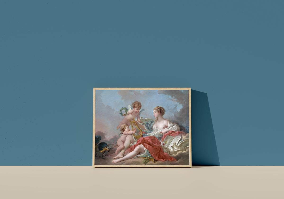 Framed art print of Allegory of Music by François Boucher, in a light wood frame leaning on a blue wall