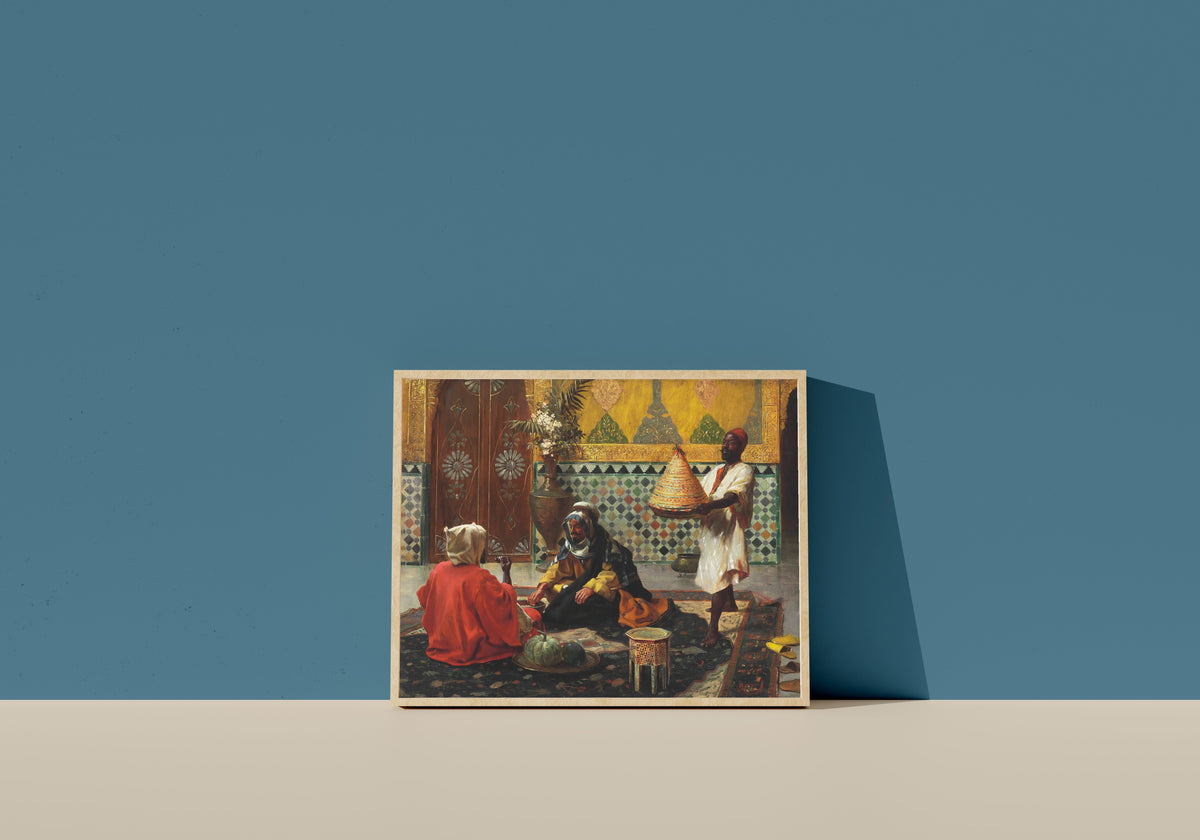 Framed art print of An Afternoon Discussion by Rudolf Ernst, in a light wood frame leaning on a blue wall