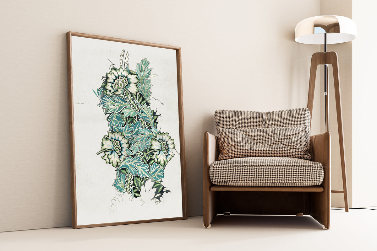 Framed art print of Anemone (Design Drawing) by William Morris, leaning against a wall beside an armchair and a floor lamp
