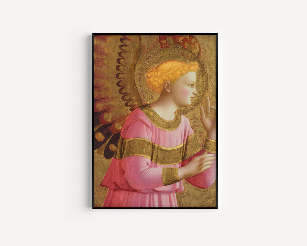 Framed art print of Annunciatory Angel by Fra Angelico, in a slim black frame on a plain white wall