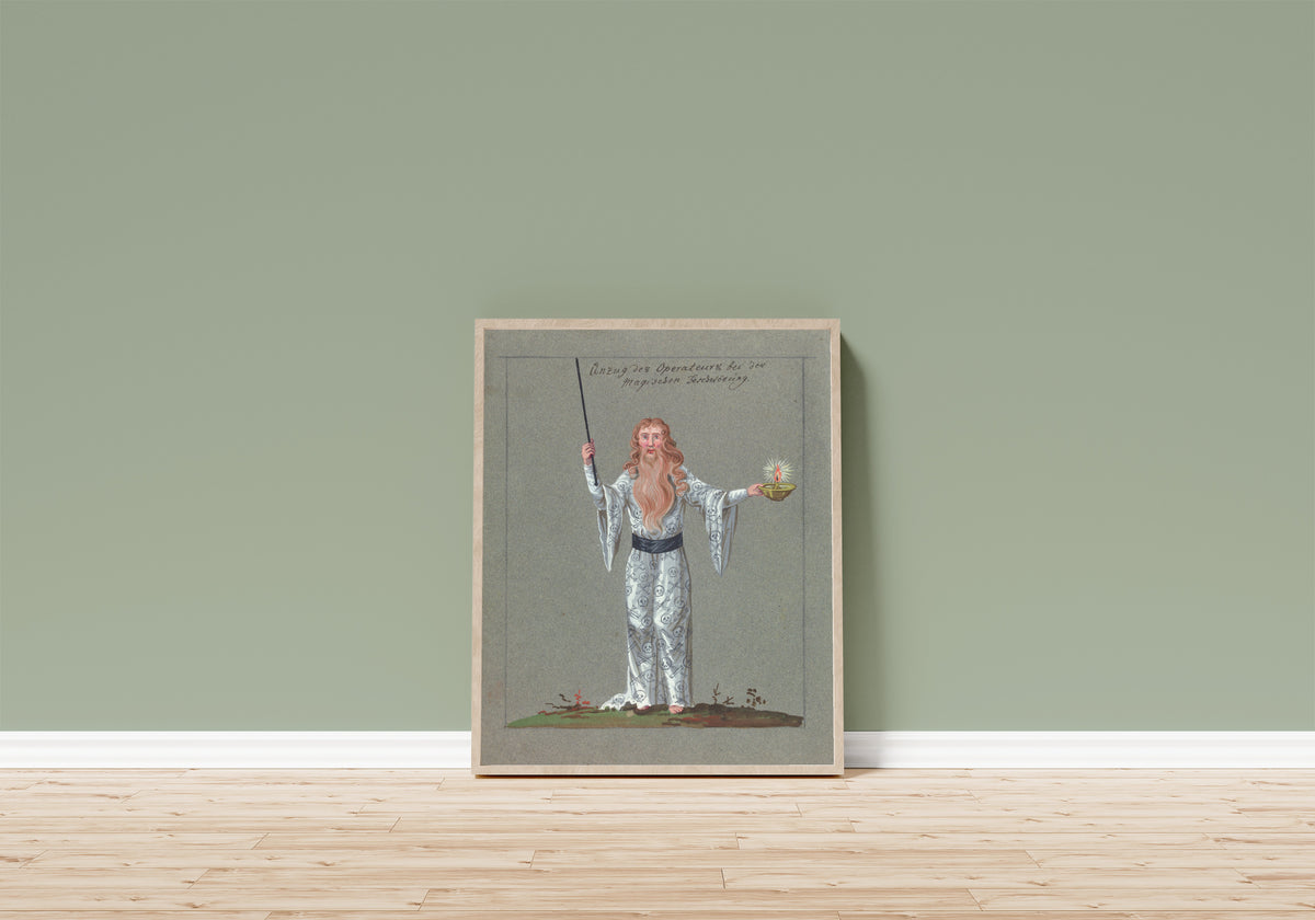 Framed art print of Anzug des Operateurs bei der magischen… by Unknown artist, in a light wood frame leaning on a sage green wall above a wooden floor