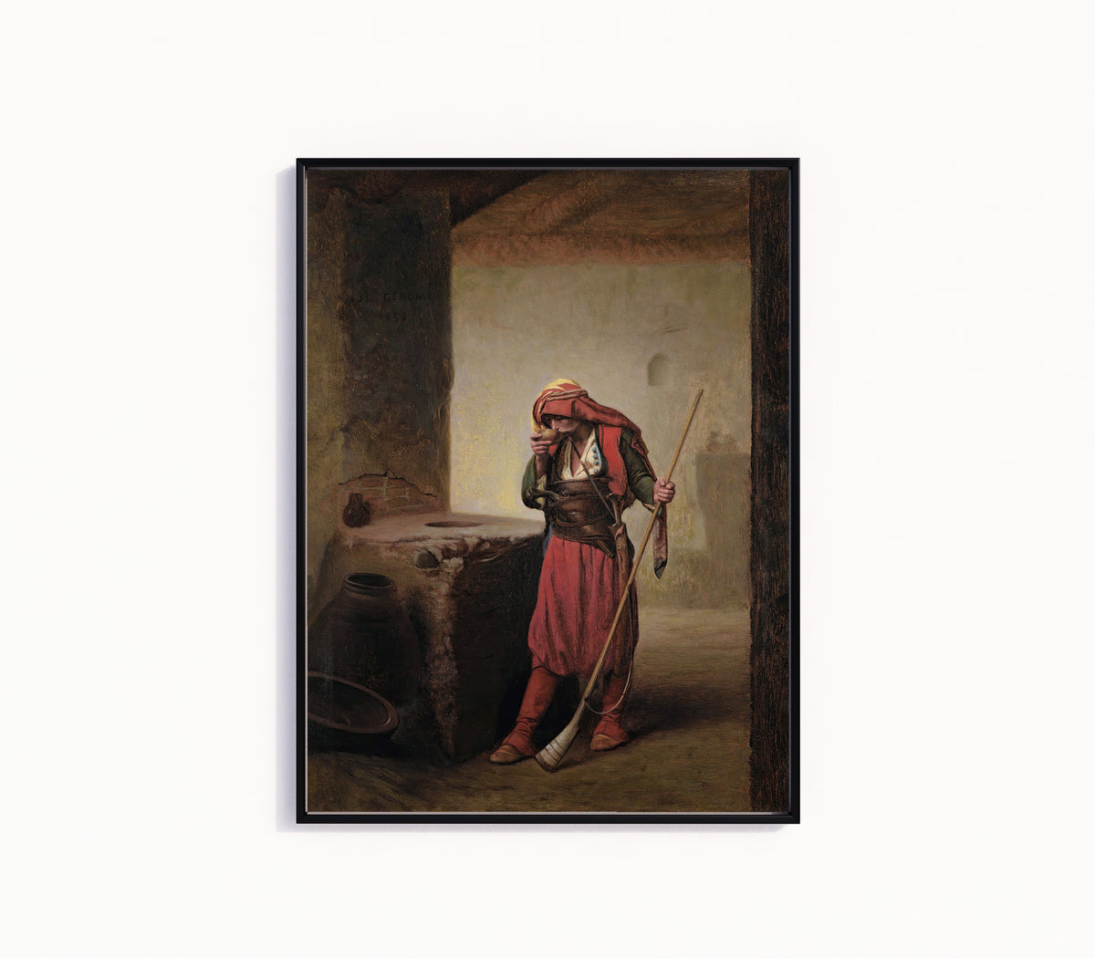 Framed art print of Arnaut Drinking by Jean-Léon Gérôme, in a slim black frame on a plain white wall
