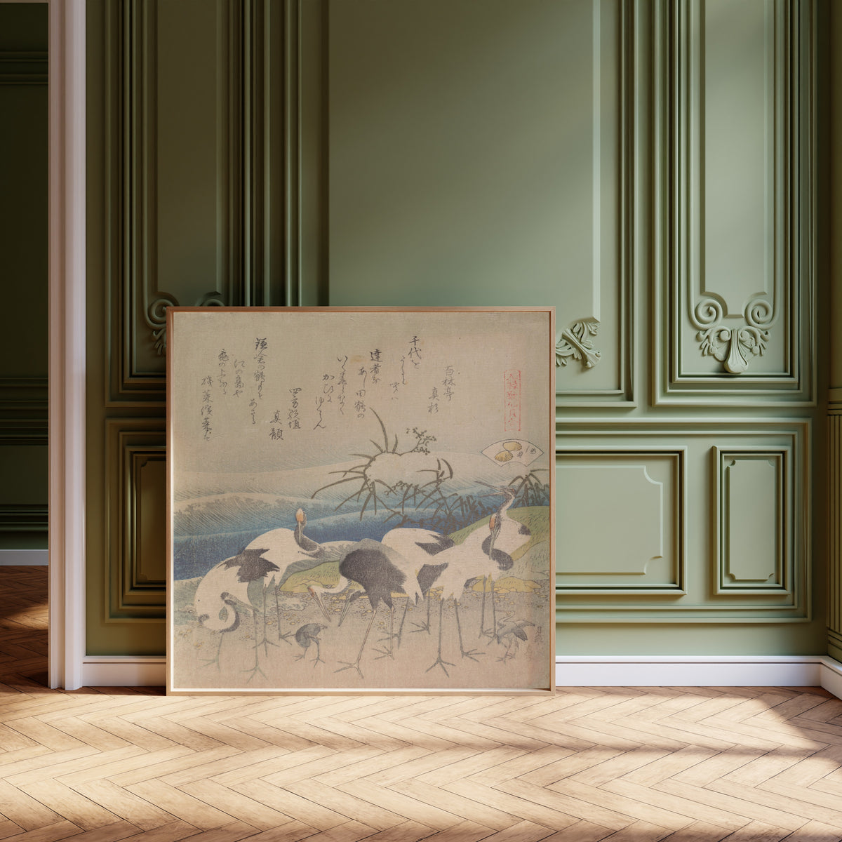 Framed art print of Ashi Clam by Katsushika Hokusai, leaning against olive-green panelling on a herringbone floor