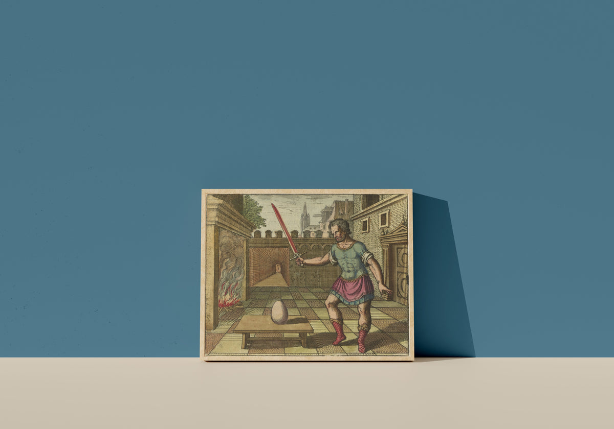 Framed art print of Atalanta Fugiens, Emblem 8: Take the Egg and Smite It With a Fiery Sword by Michael Maier, in a light wood frame leaning on a blue wall