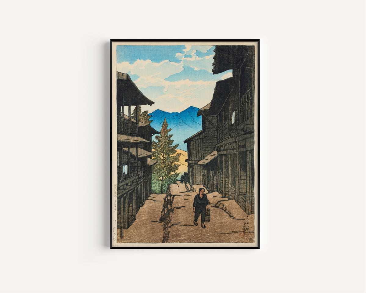 Framed art print of Autumn in Arayu, Shiobara by Kawase Hasui, in a slim black frame on a plain white wall