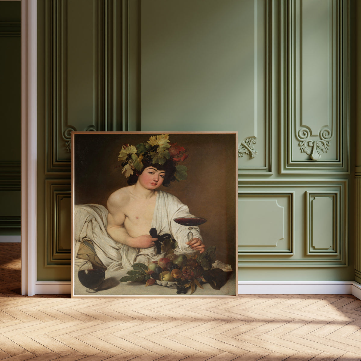 Framed art print of Bacchus by Caravaggio, leaning against olive-green panelling on a herringbone floor