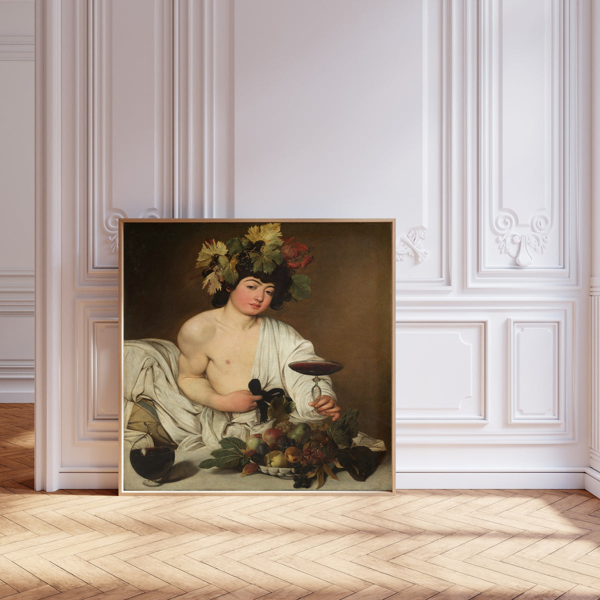 Framed art print of Bacchus by Caravaggio, leaning against pale pink panelling on a herringbone floor