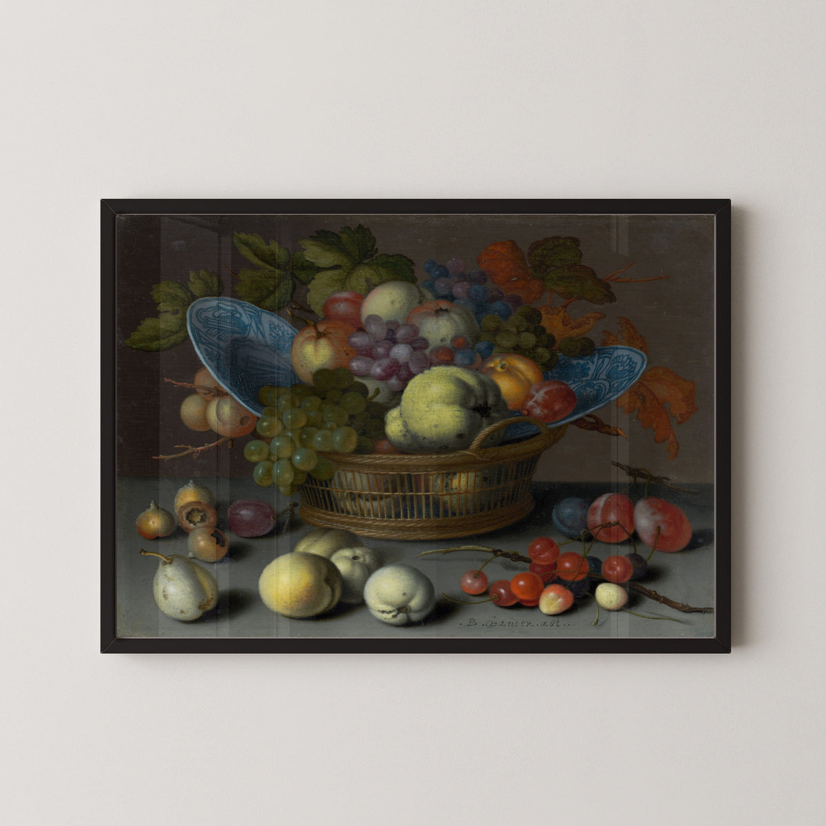Basket of Fruits by Balthasar van der Ast — in a black frame on a pale wall