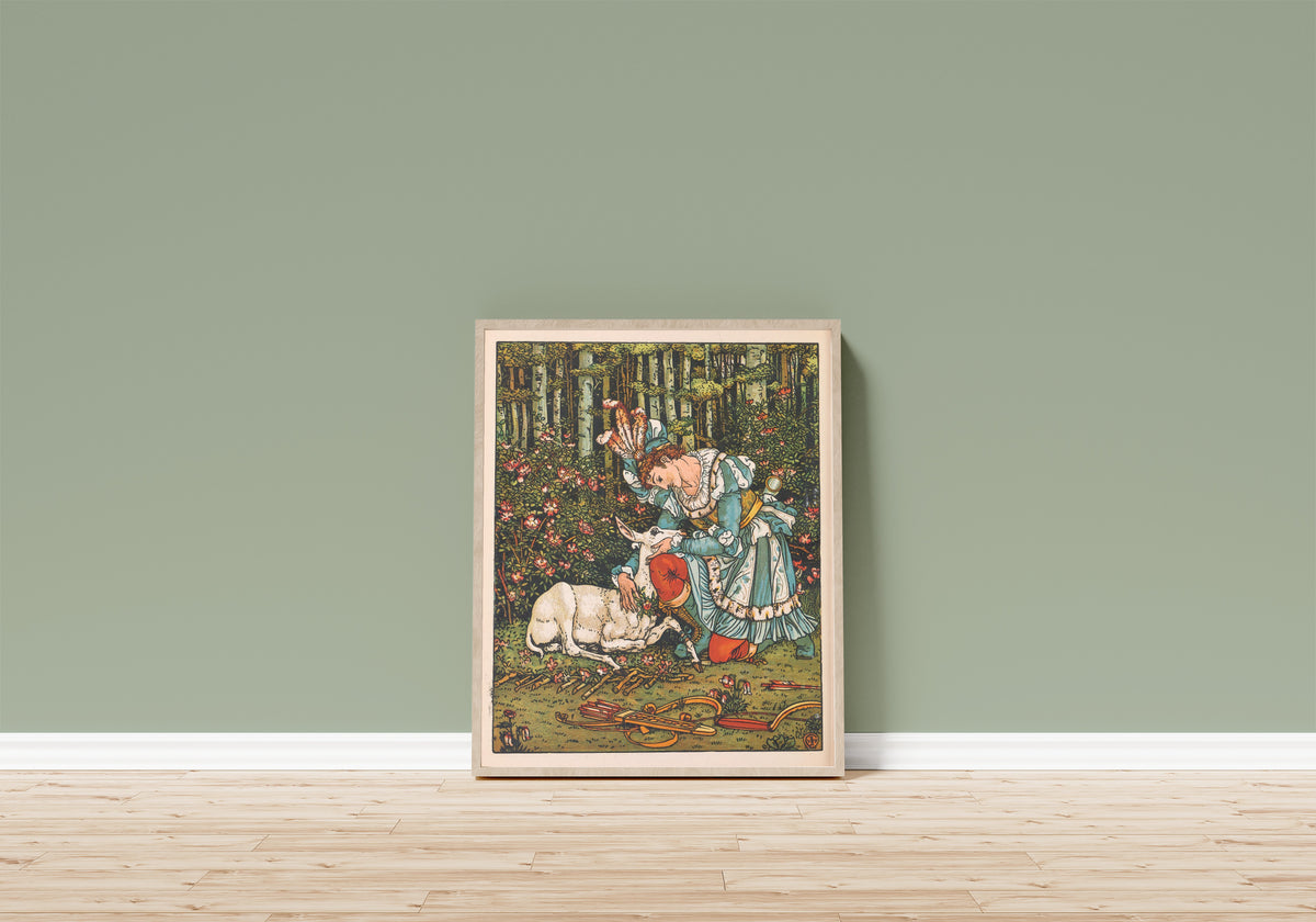 Framed art print of Beauty and the Beast: Plate 17 by Walter Crane, in a light wood frame leaning on a sage green wall above a wooden floor