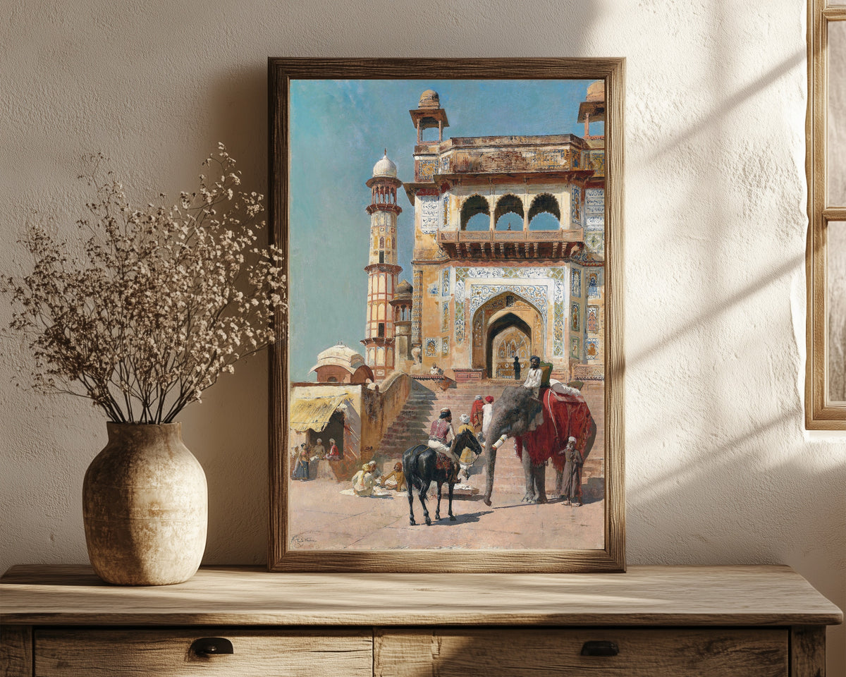 Framed art print of Before the Great Jami Masjid Mosque, Mathura… by Edwin Lord Weeks, in a dark wood frame leaning on a rustic console beside dried flowers