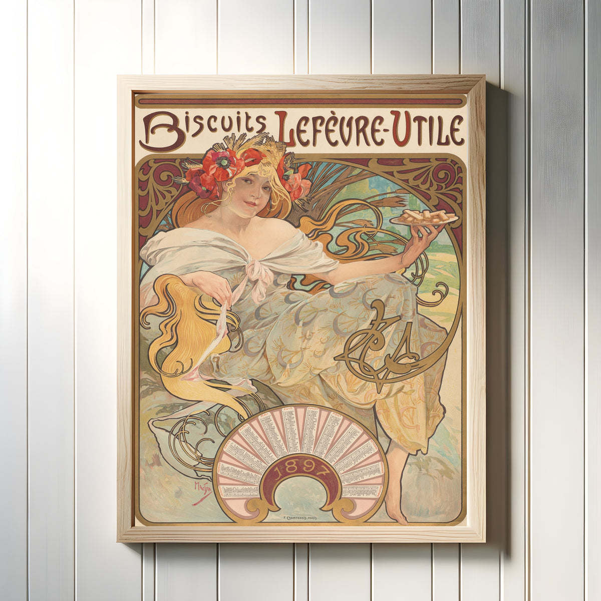 Framed art print of Biscuits Lefèvre-Utile by Alphonse Mucha, in a light wood frame on a white panelled wall