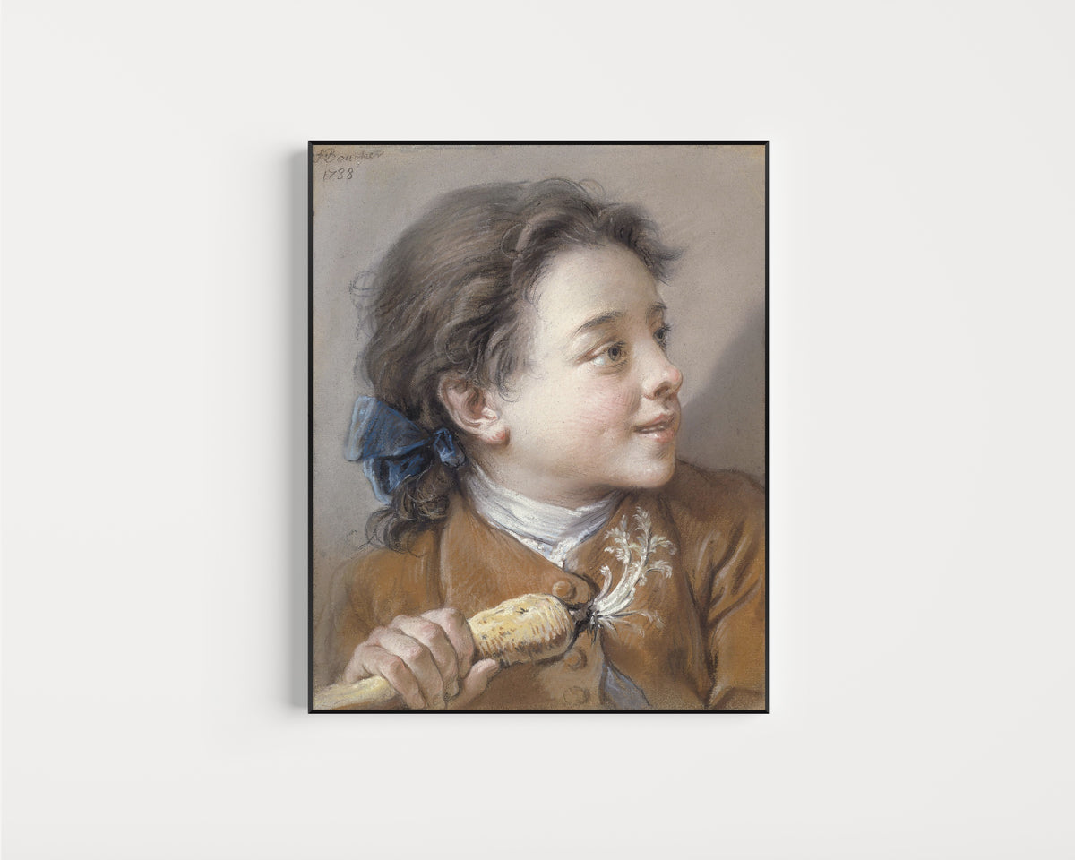 Framed art print of Boy with a Carrot by François Boucher, in a slim black frame on a plain white wall
