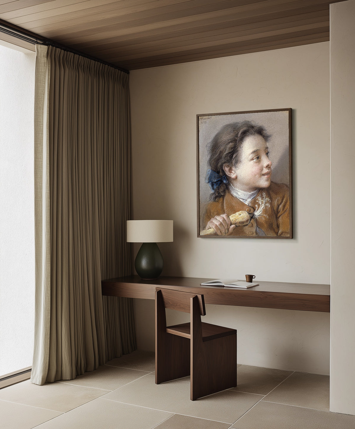 Framed art print of Boy with a Carrot by François Boucher, in a dark wood frame on a plaster wall above a walnut desk