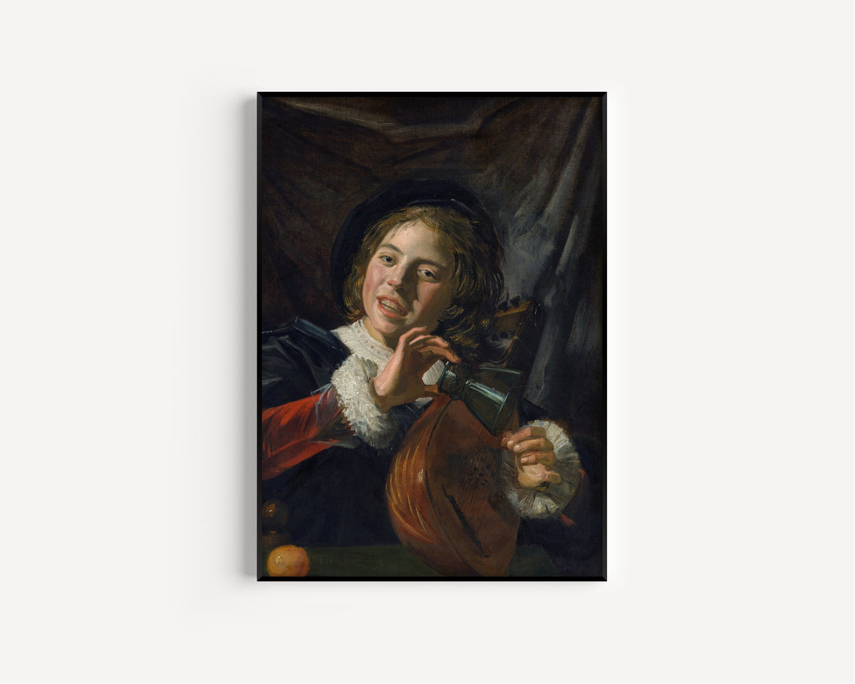 Framed art print of Boy with a Lute by Frans Hals, in a slim black frame on a plain white wall