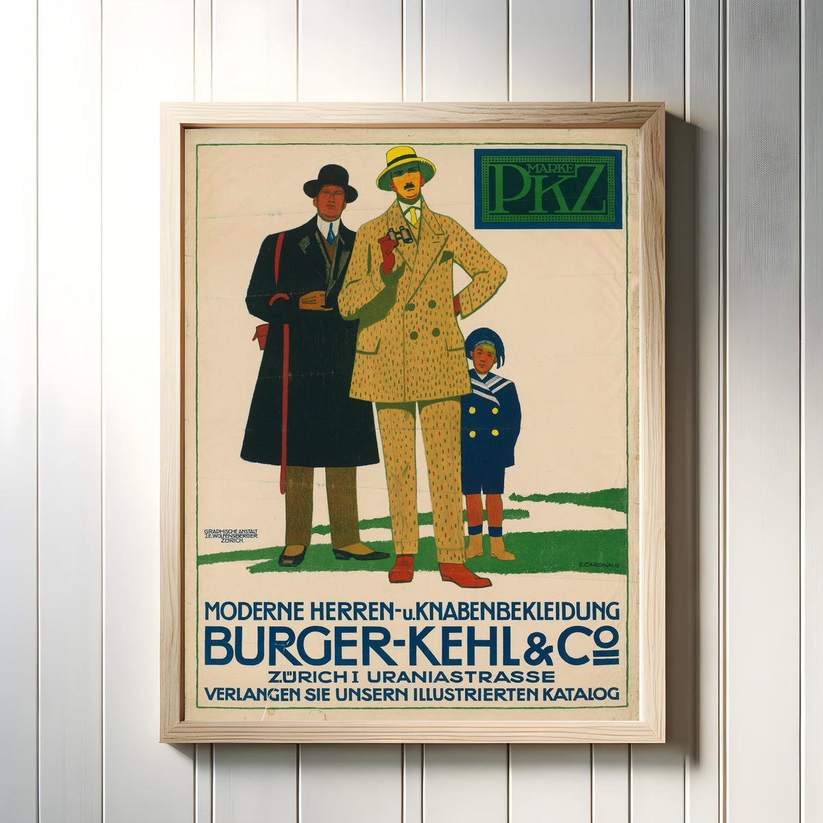 Framed art print of Burger-Kehl & Co: Moderne Herren- und Knabenbekleidung by Emil Cardinaux, in a light wood frame on a white panelled wall