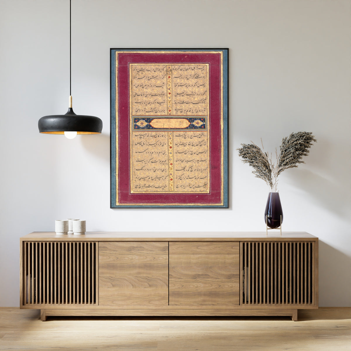Framed art print of Bustan of Sa'di: A Page of Text, above a slatted wood sideboard