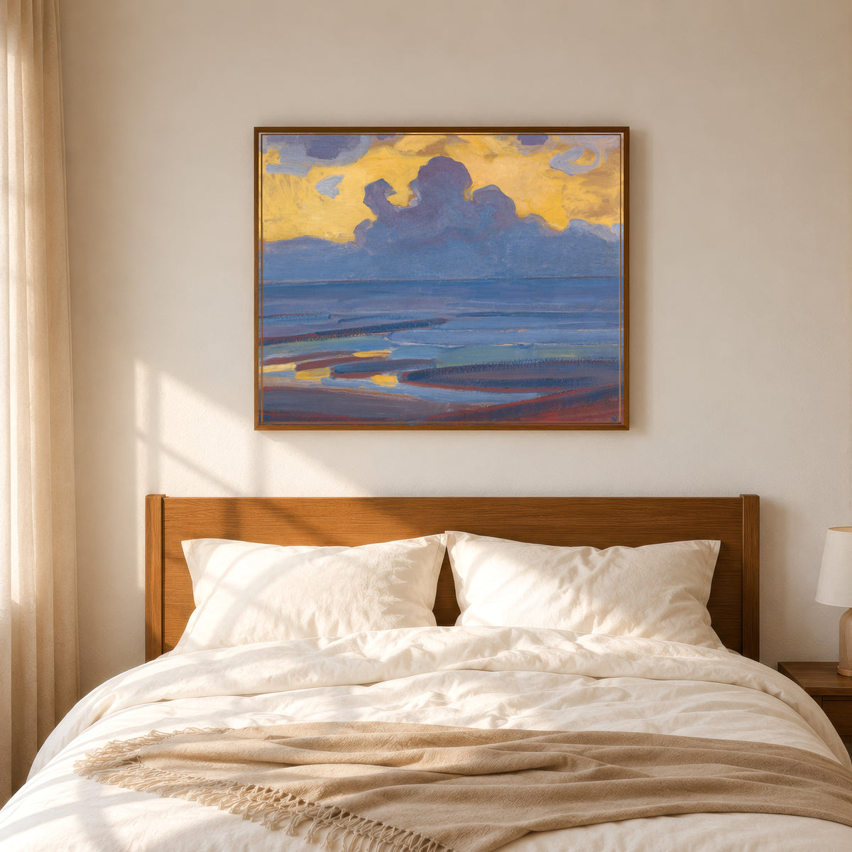 Framed art print of By the Sea by Piet Mondrian, in a slim wood frame above a bed in a sunlit bedroom