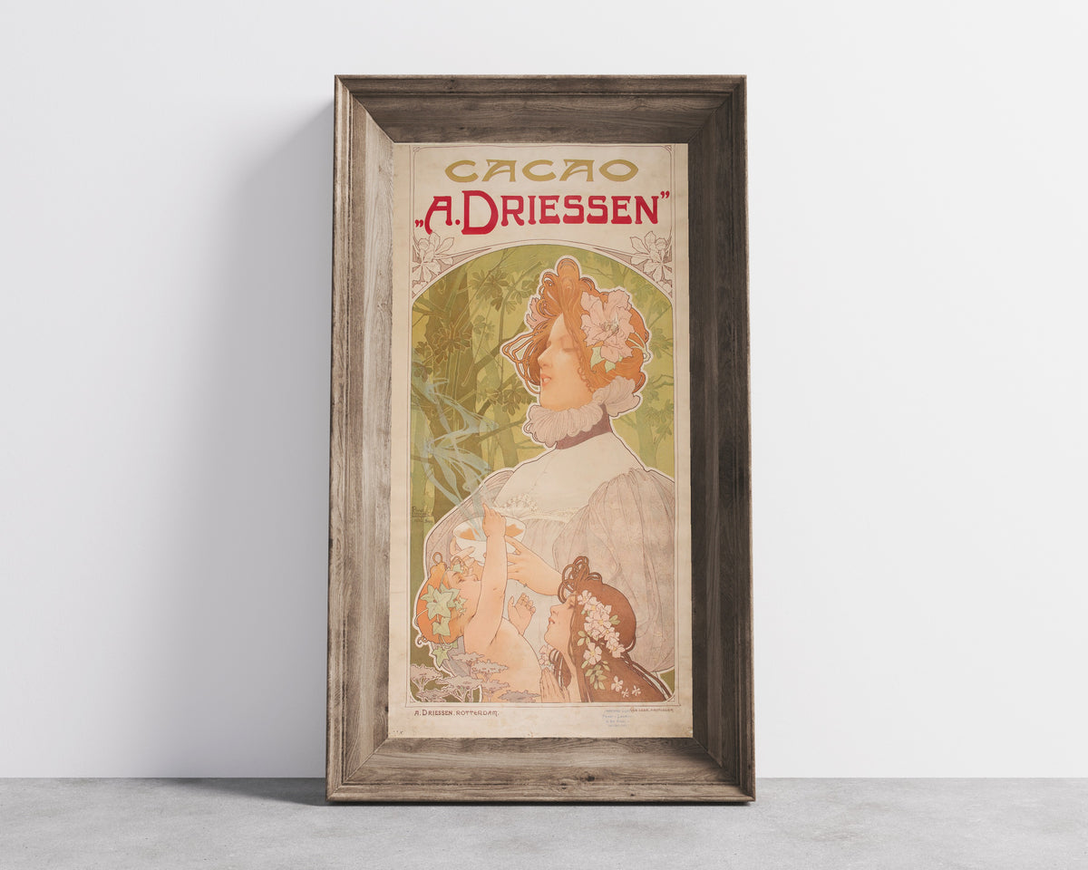 Framed art print of Cacao A. Driessen by Henri Privat-Livemont, in a wide wooden frame leaning against a concrete wall