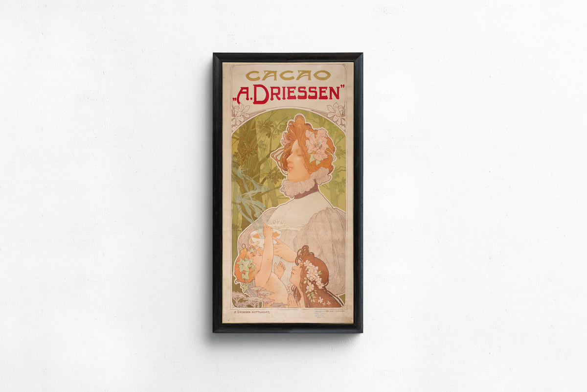 Framed art print of Cacao A. Driessen by Henri Privat-Livemont, in a slim black frame on a plain white wall