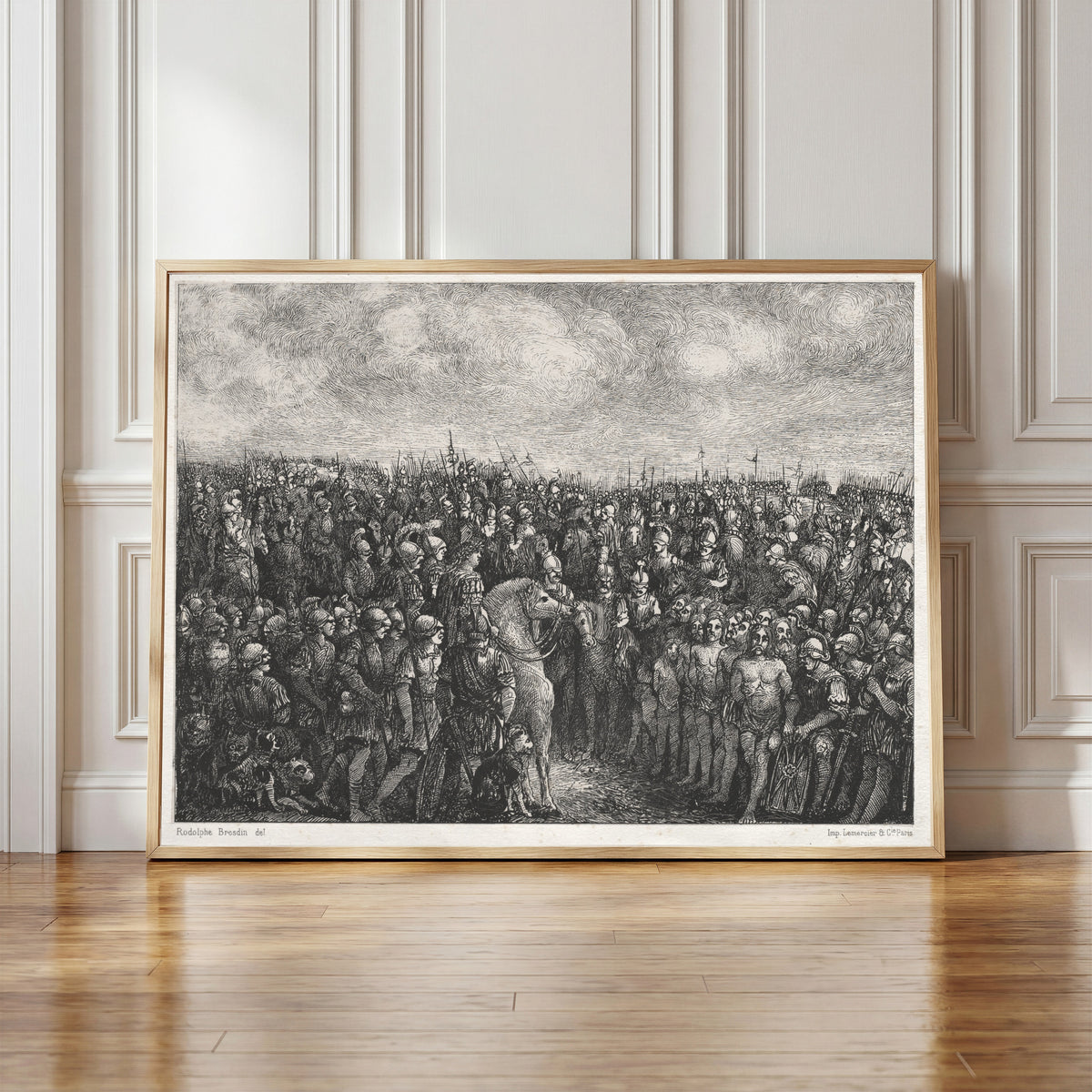 Framed art print of Caesar and his Prisoners by Rodolphe Bresdin, in a light wood frame leaning against a panelled white wall