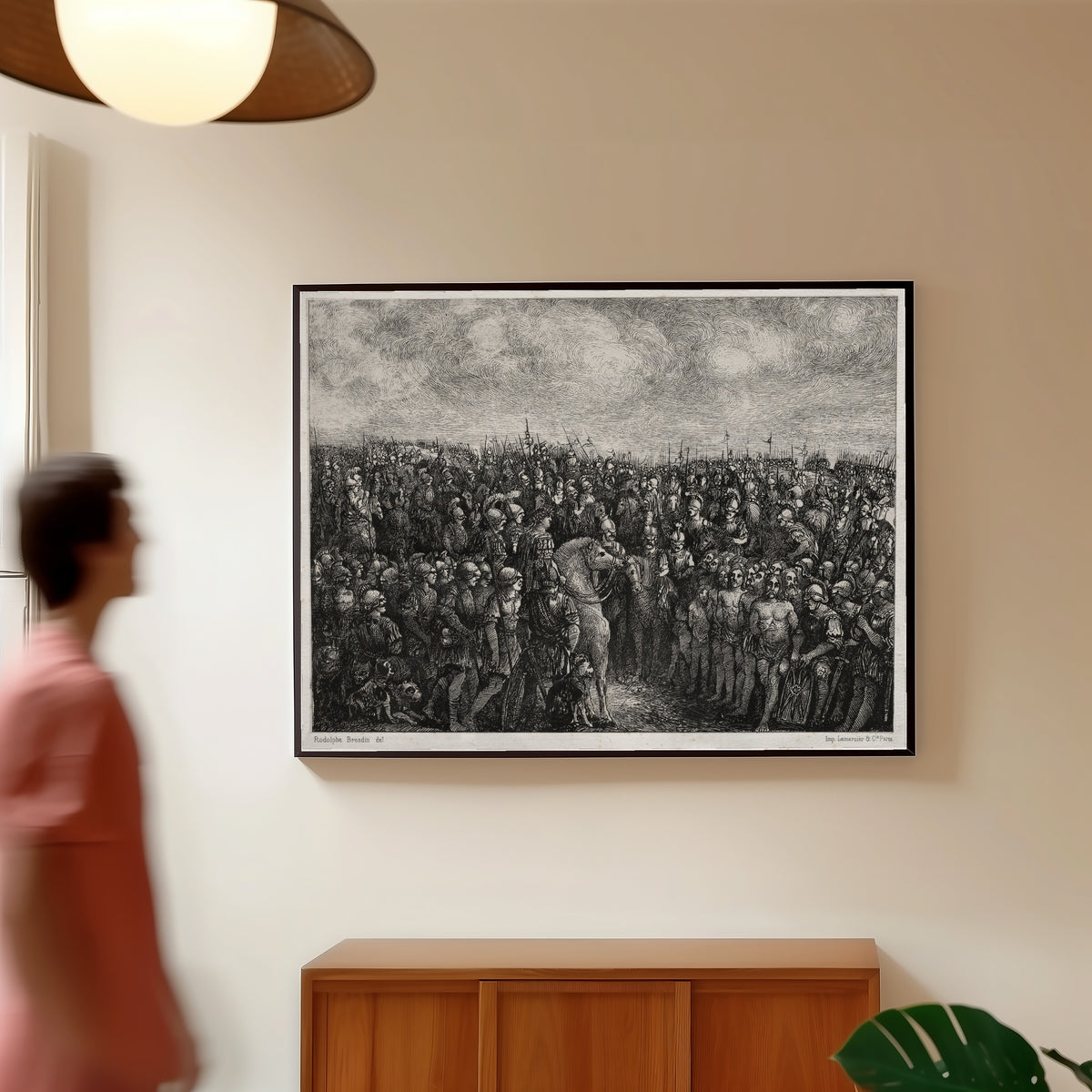 Framed art print of Caesar and his Prisoners by Rodolphe Bresdin, in a slim black frame on a warm wall in a sunlit room