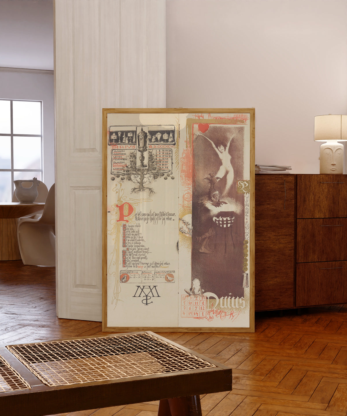 Framed art print of Calendrier magique: Philtre d'amour (May) by Manuel Orazi, in a light wood frame leaning in a warm room with a parquet floor