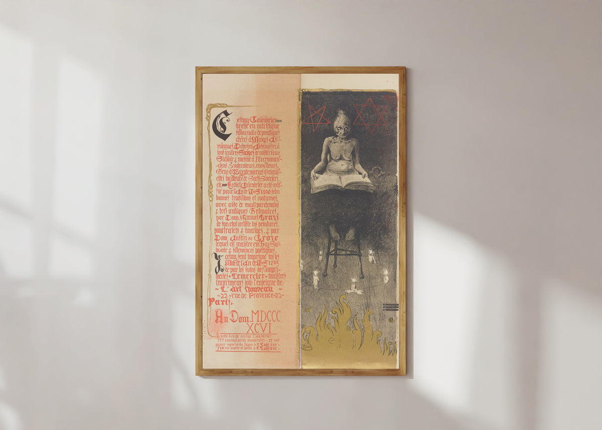 Framed art print of Calendrier magique, Plate 2 by Manuel Orazi, in a light wood frame on a sunlit white wall