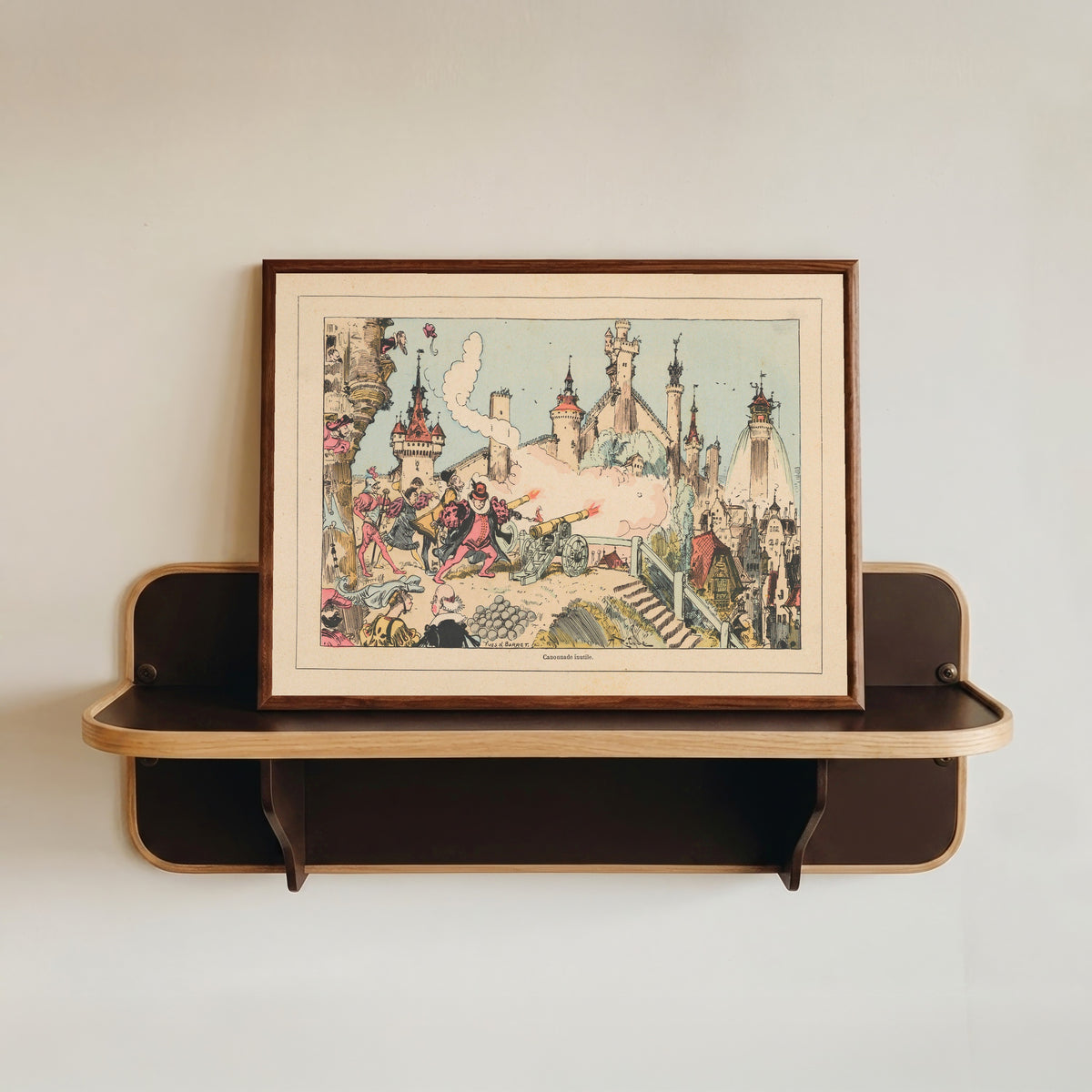 Framed art print of Canonnade inutile by Albert Robida, in a dark wood frame resting on a wall shelf