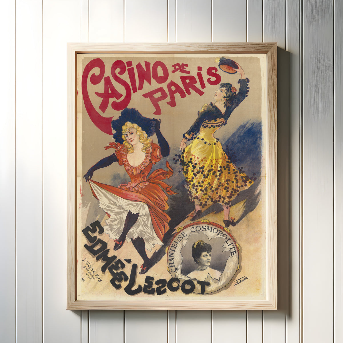 Framed art print of Casino de Paris: Edmée Lescot, chanteuse cosmopolite by Georges de Feure, in a light wood frame on a white panelled wall