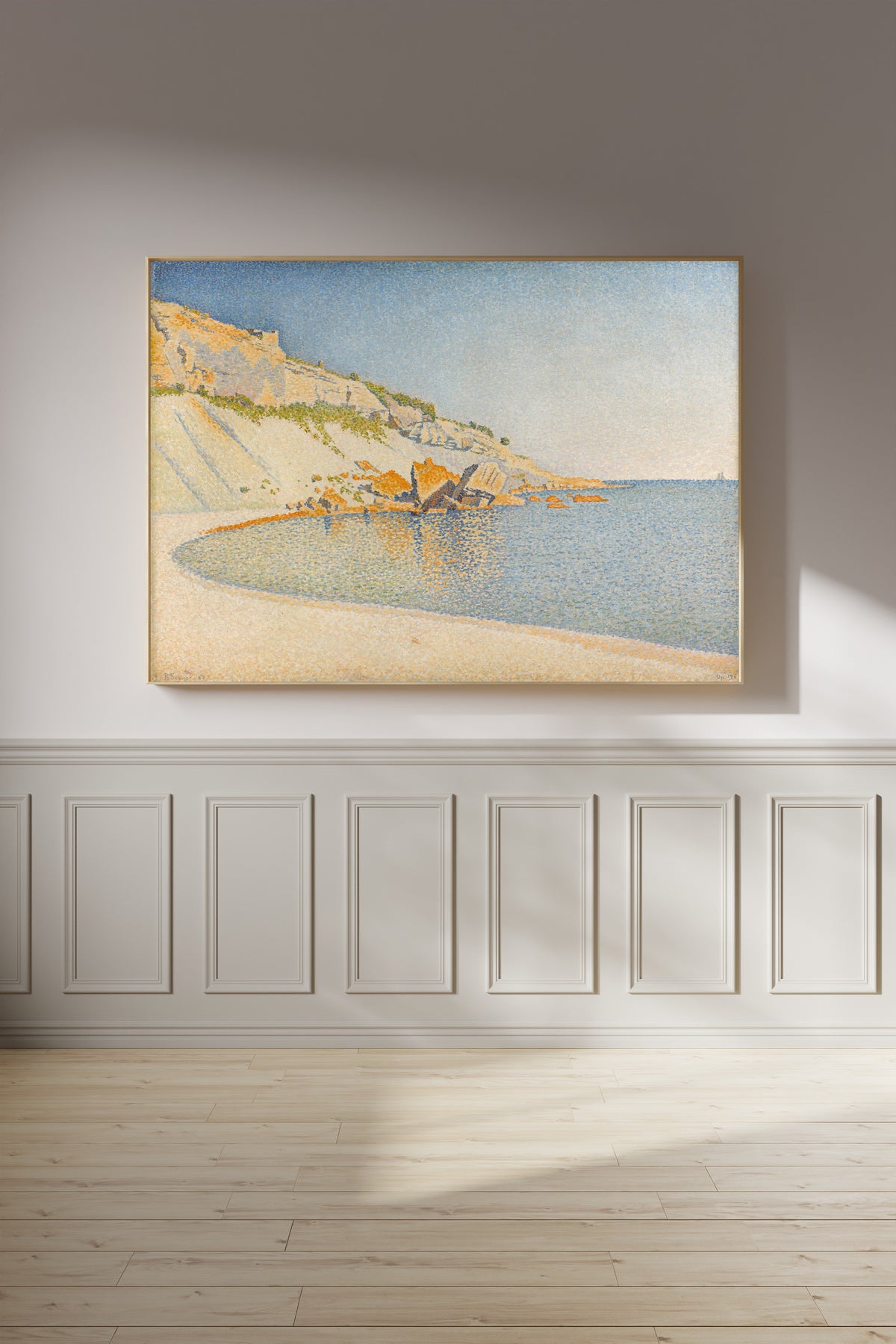 Framed art print of Cassis, Cap Lombard, Opus 196 by Paul Signac, on a panelled wall in afternoon light