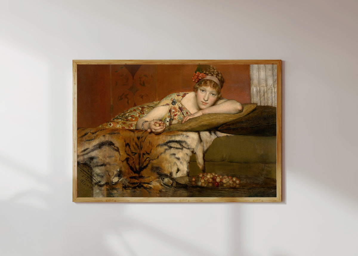 Framed art print of Cherries by Lawrence Alma-Tadema, in a light wood frame on a sunlit white wall