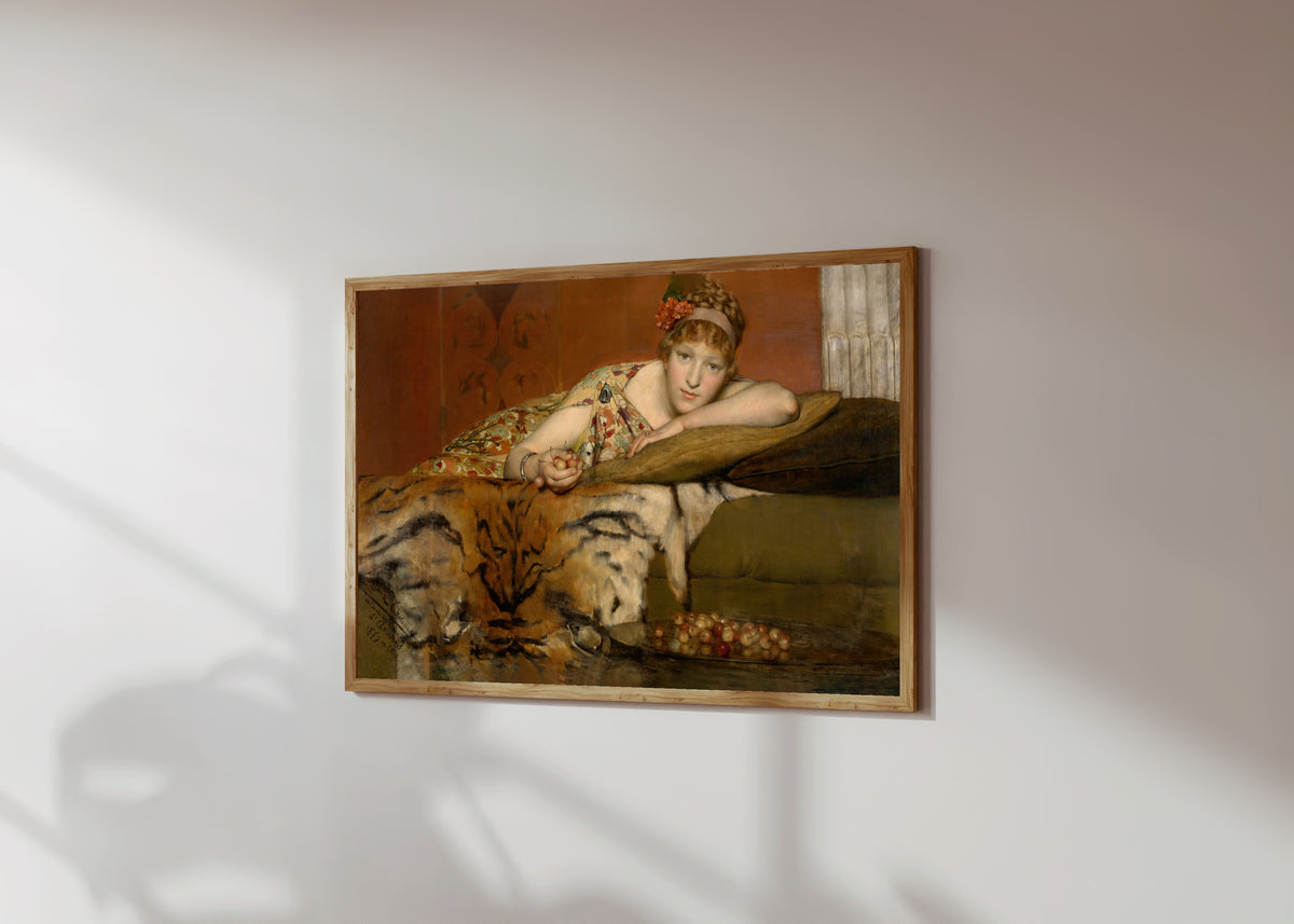 Framed art print of Cherries by Lawrence Alma-Tadema, in a light wood frame on a sunlit white wall, seen at a slight angle