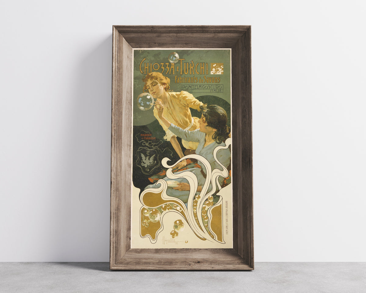 Framed art print of Chiozza e Turchi, Fabricants de Savons, Pontelagoscuro by Adolfo Hohenstein, in a wide wooden frame leaning against a concrete wall