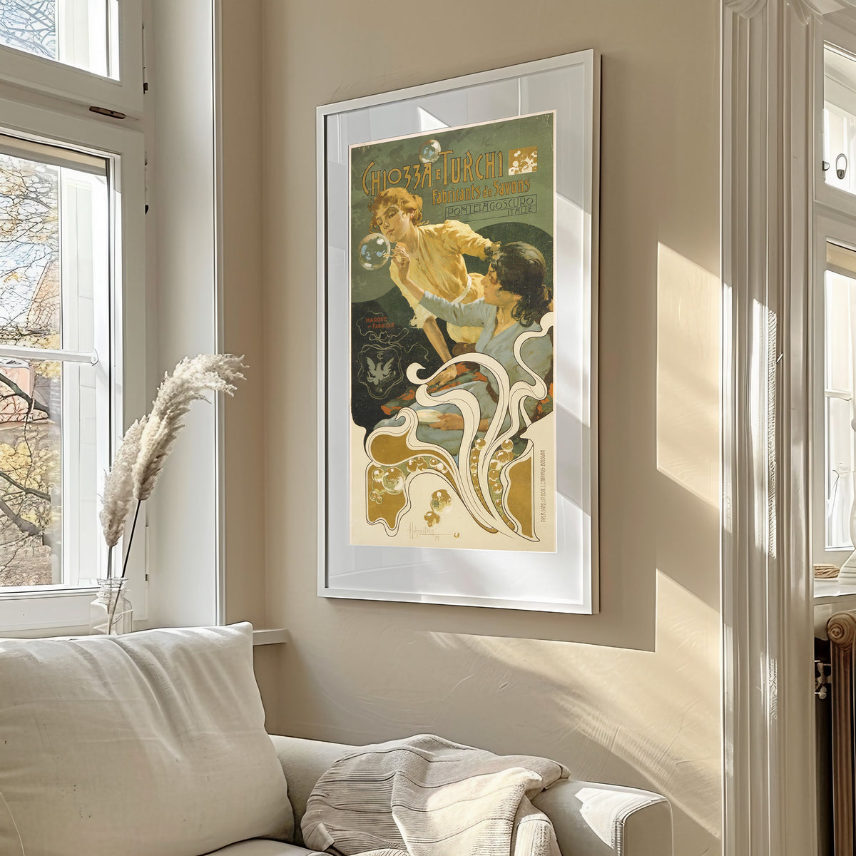 Framed art print of Chiozza e Turchi, Fabricants de Savons, Pontelagoscuro by Adolfo Hohenstein, in a sunlit living room above a sofa