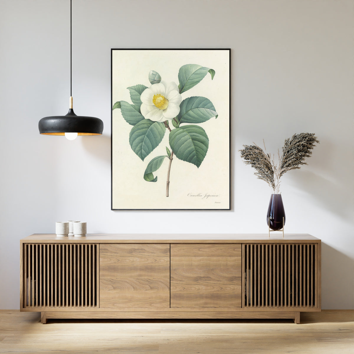 Framed art print of Choix des plus belles fleurs, Plate 16: Camellia Japonica by Pierre-Joseph Redouté, above a slatted wood sideboard